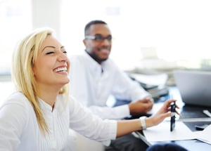 Business people working in office and laughing/smiling