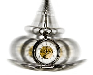 clock in motion over white - time moving