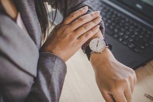 businesswoman-checking-time-watch