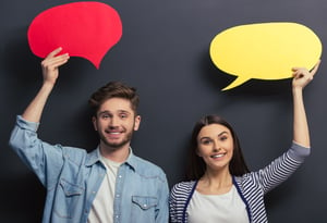 couple-casual-clothes-is-holding-colorful-speech-bubbles