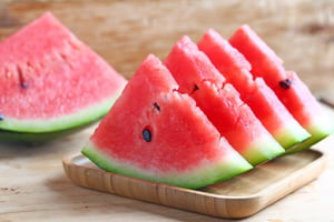 fresh-sliced-watermelon-wooden-background