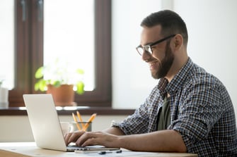 happy-male-writing-positive-mail-client