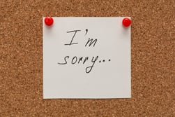 i-am-sorry-inscription-text-written-white-paper-pined-cork-board