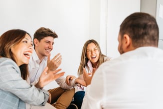 multiracial-group-coworkers-laughing-together