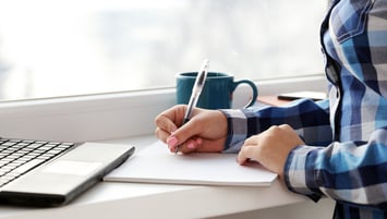 woman-writes-notebook