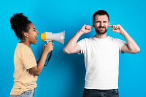 woman-yelling-man-through-megaphone