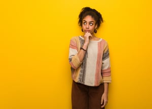 young-black-african-american-girl-with-blue-eyes-thinking-about-idea