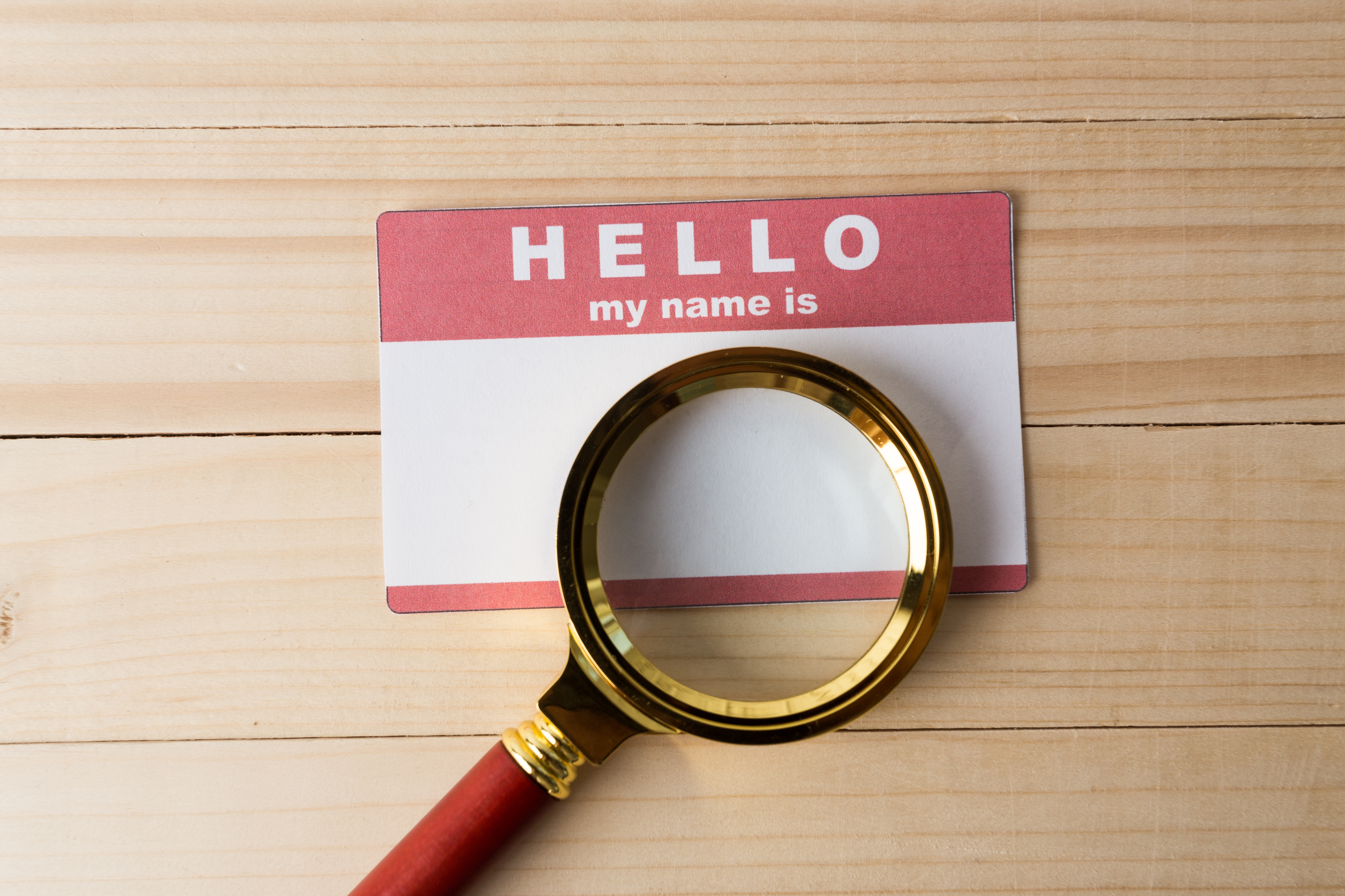 hello name tags with magnifying glass