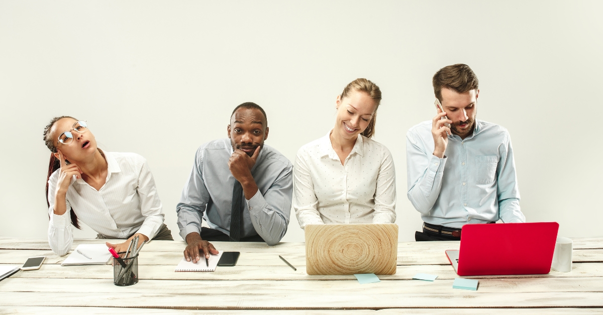 4 coworkers expressing different emotions experienced while in a meeting