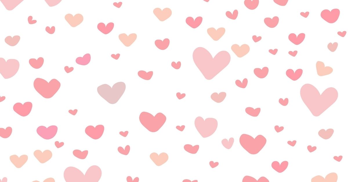 Hand drawn hearts of various sizes and shades of pink on a white background