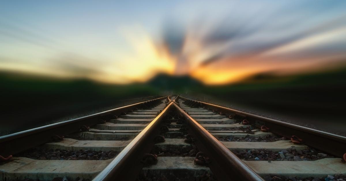 railroad looking into a blurry sunset