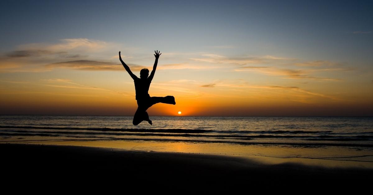 Person jumping in the sunset
