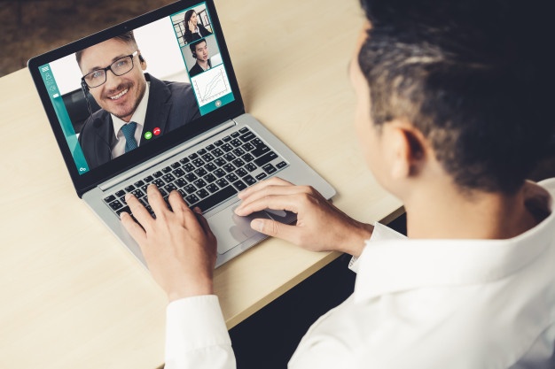 man on computer for a video call 