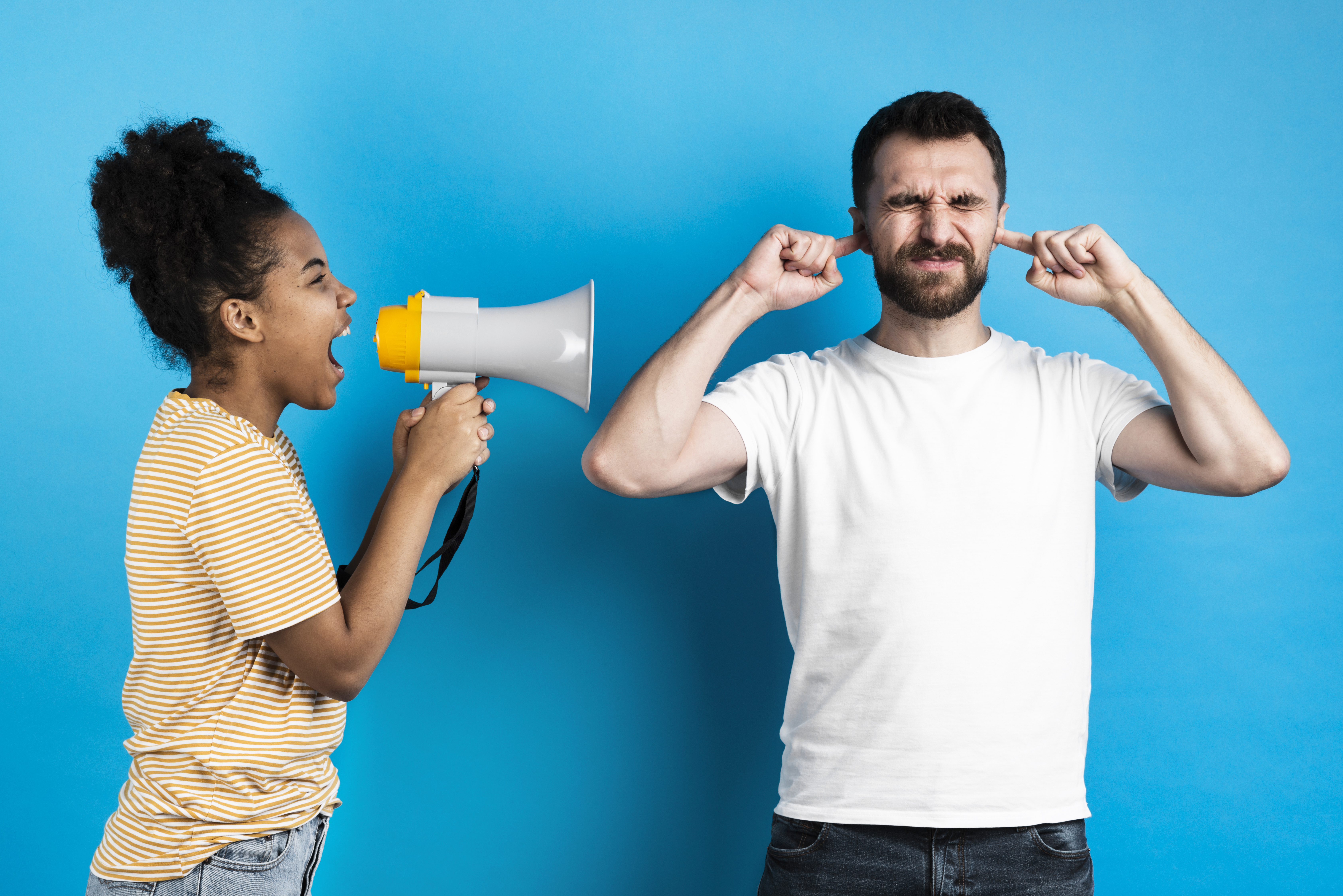 woman-yelling-man-through-megaphone